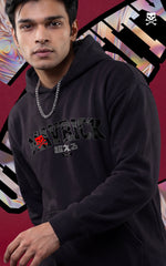 Front view of a male model in a black Mavrick graphic hoodie featuring Japanese characters and a silver chain, showcasing an urban streetwear look.