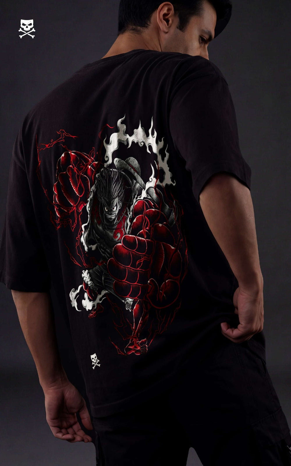 Back view of a drop-shoulder black tee featuring Luffy in Gear 4 Bounceman with red Haki energy and steam effects.