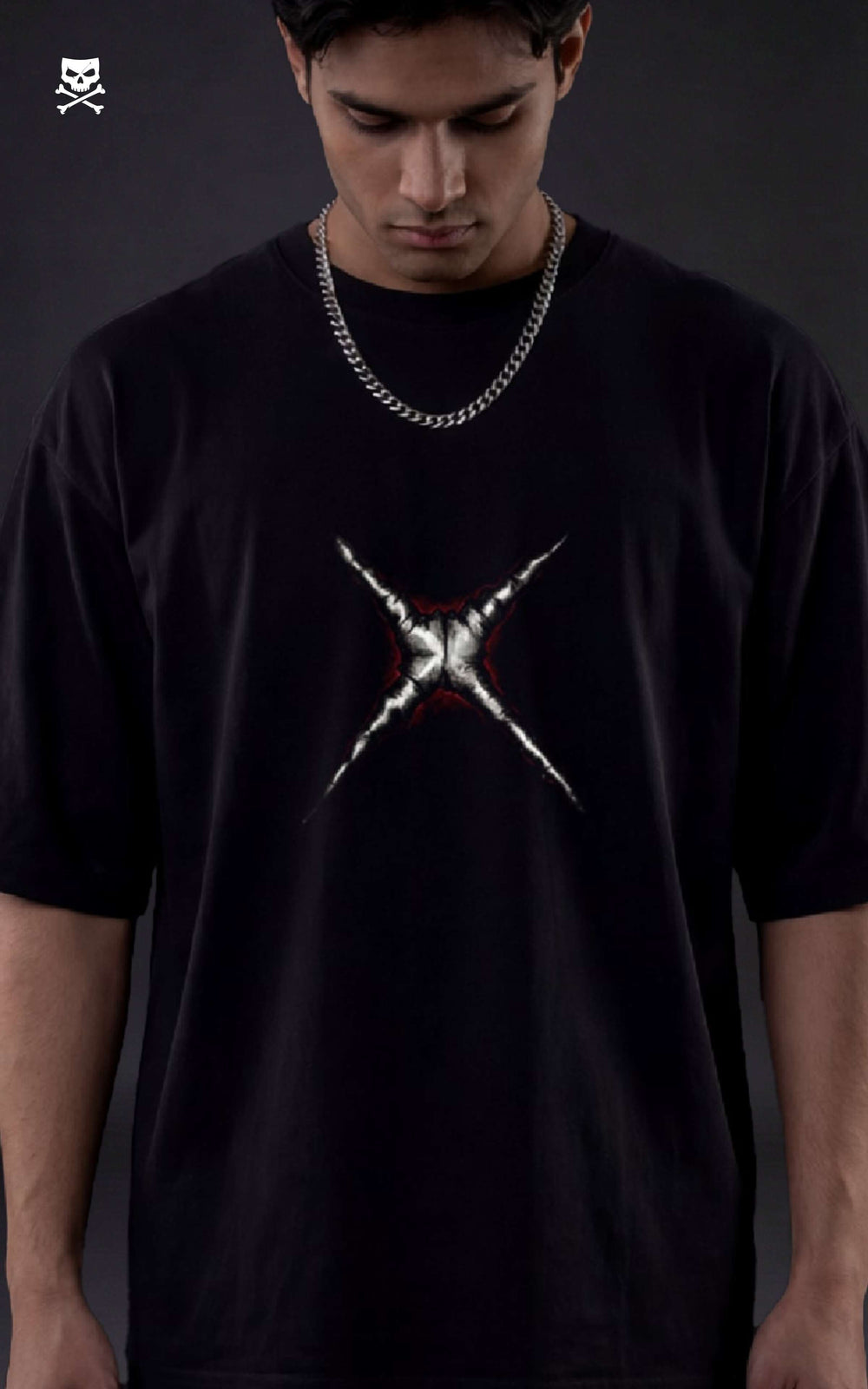 Person wearing a black t-shirt with a white graphic design on a dark background