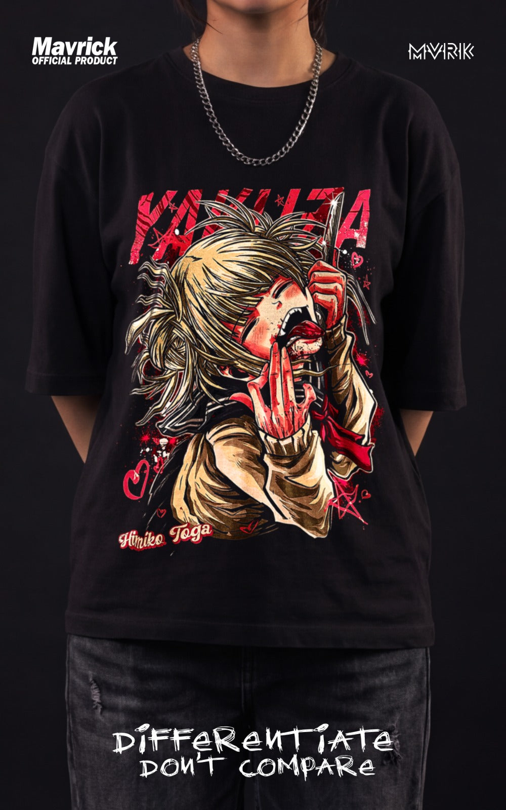 The back of a black t-shirt showing a small, circular graphic of a white cat-like mask with the word "KURO" written on its forehead, surrounded by red splatters.