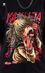 A close-up of a black t-shirt featuring a highly detailed, gritty anime illustration of Himiko Toga with blood on her face and hands, set against large red "YAKUZA" text.