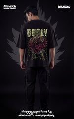 Back view of a male model in a drop-shoulder black shirt featuring a Legendary Super Saiyan Broly graphic with neon green energy bursts.