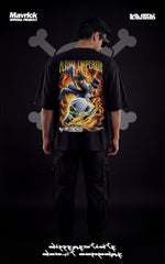 Back view of an oversized black anime t-shirt with a vibrant fire graphic of Sabo in his Flame Emperor form.