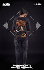 Female model in a heavyweight black t-shirt featuring a demonic Bankai graphic of Kenpachi Zaraki with orange spiritual energy.