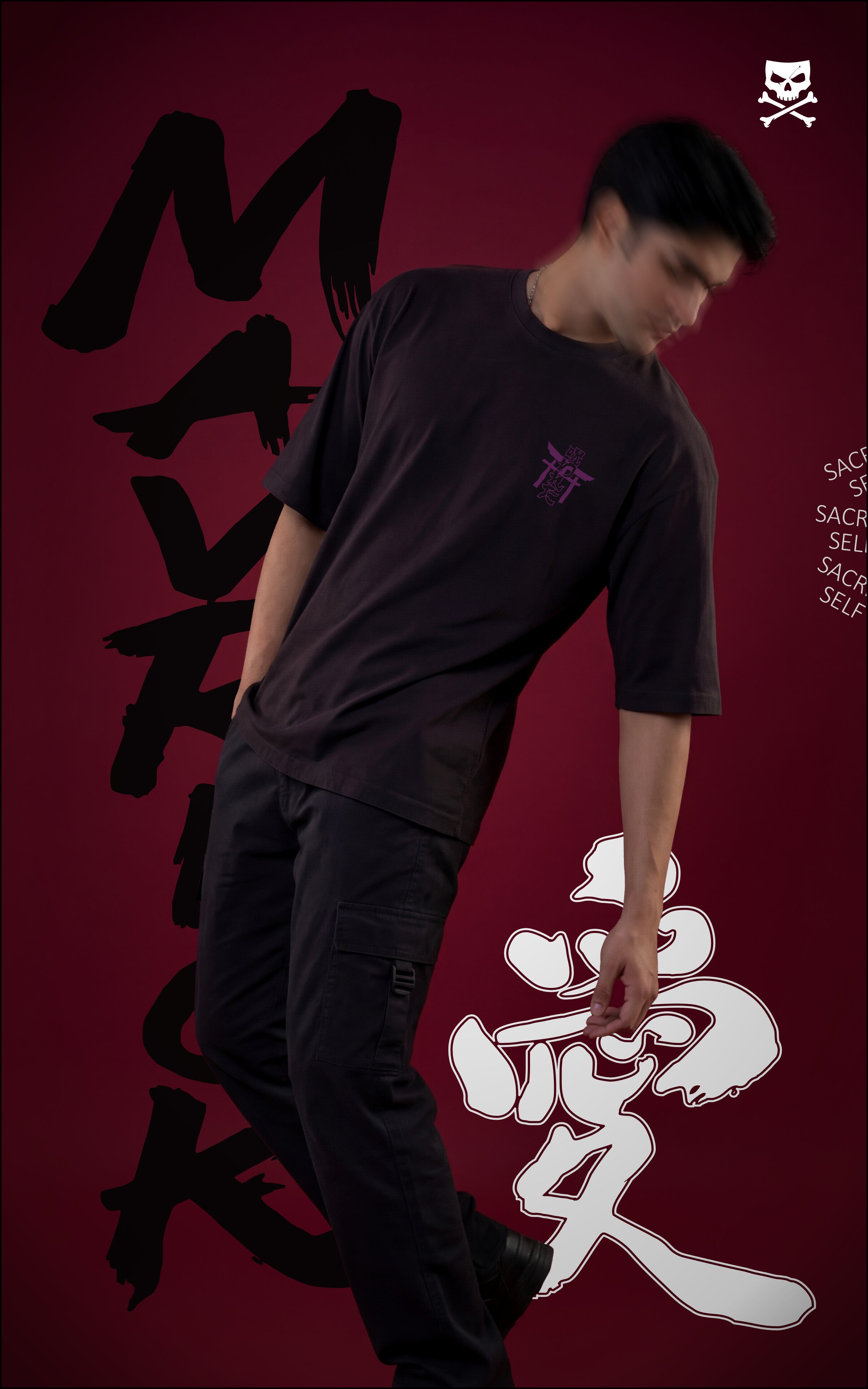 Front view of a model in a black streetwear tee and cargo pants featuring a small purple torii gate logo on the chest. The dark red backdrop includes large white and black Japanese kanji characters and "MAVRICK" text.
