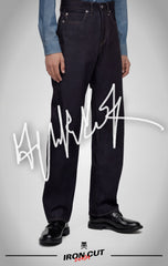 Model wearing IRON CUT dark indigo straight-leg selvedge jeans.