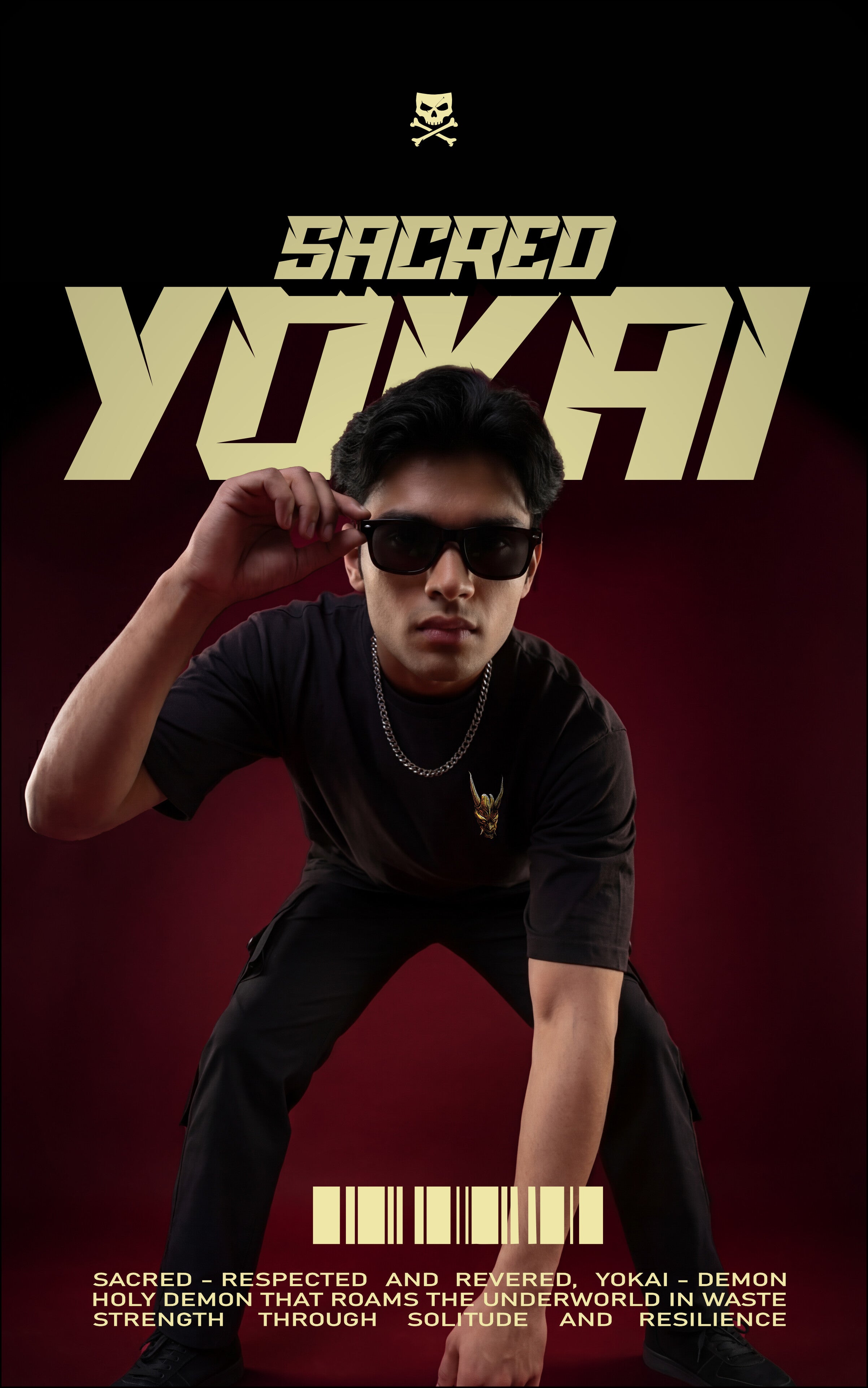 
Male model in an oversized black streetwear t-shirt and cargo pants posing against a dark maroon background. The image features bold "SACRED YOKAI" typography and text describing a "Holy Demon" that represents strength through solitude.