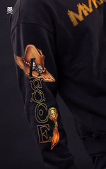 Male model in a side pose showcasing the sleeve graphic of a Portgas D. Ace hoodie, featuring Ace’s signature cowboy hat and vertical "ACE" typography on a premium black cotton sweatshirt.