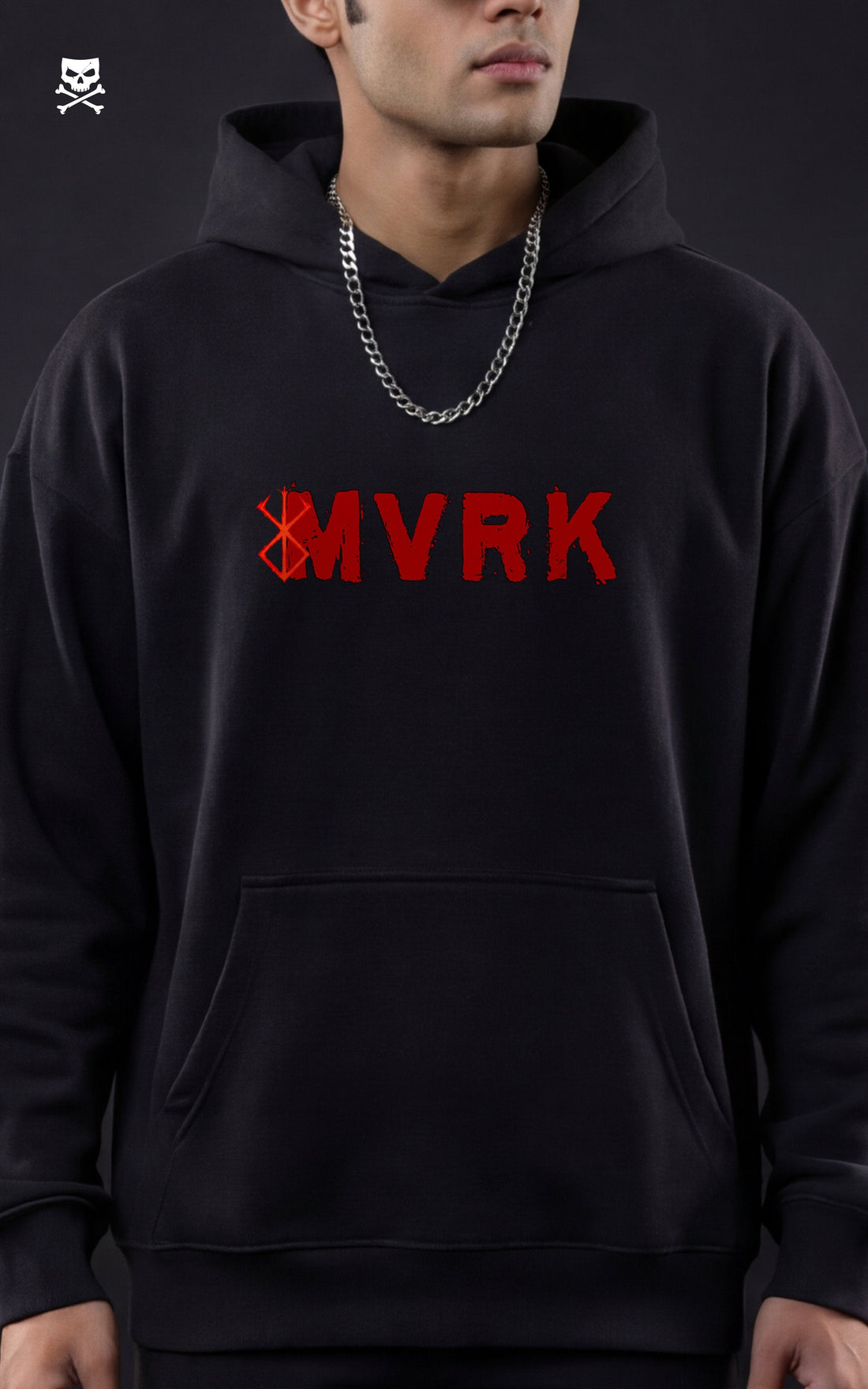 Back view of a model wearing a Mavrick official black streetwear hoodie featuring a large red and grey Guts "Berserk" manga illustration with Japanese kanji, styled with black cargo pants in a dark studio setting.