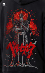 Close-up detail of the Guts Berserker Armor back print on a black hoodie, showcasing intricate line art of the character leaning on his sword with a crimson eclipse sun and red "Berserk" typography.