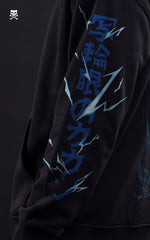 Side profile of a black Mavrick hoodie showcasing blue Japanese kanji and lightning bolt graphics on the sleeve, inspired by Kakashi's Chidori.
