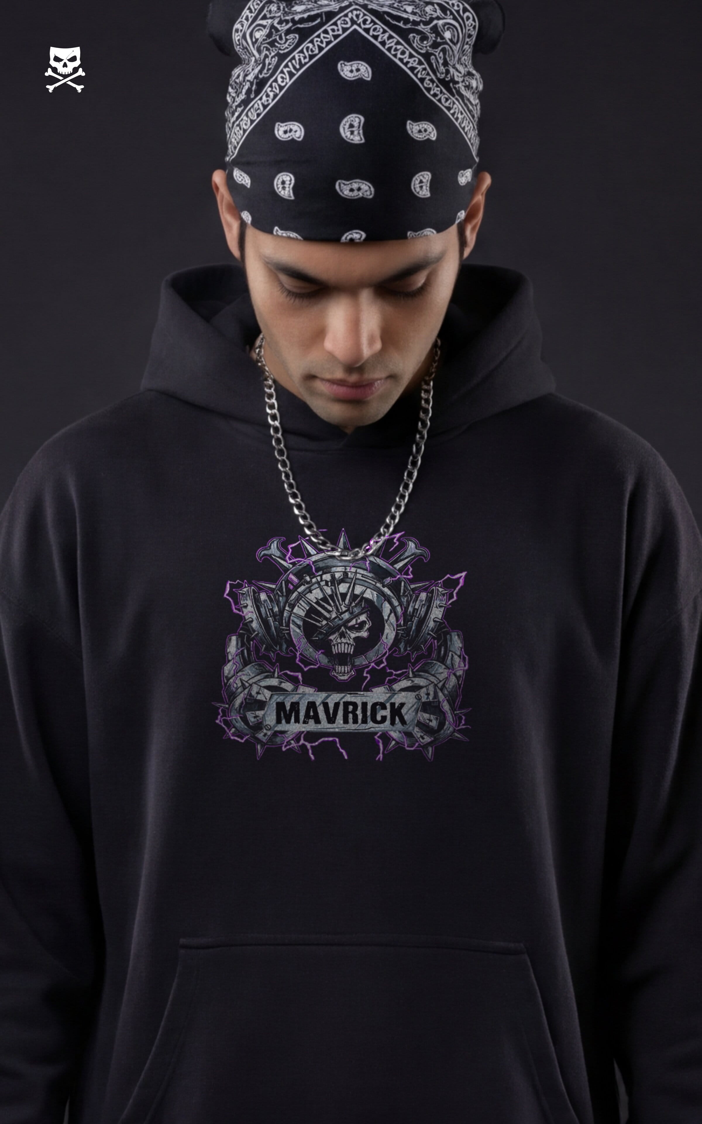Front view of a model in a black Mavrick streetwear hoodie featuring a purple and silver Eustass Kid skull logo on the chest, styled with a black paisley bandana and silver chain.
