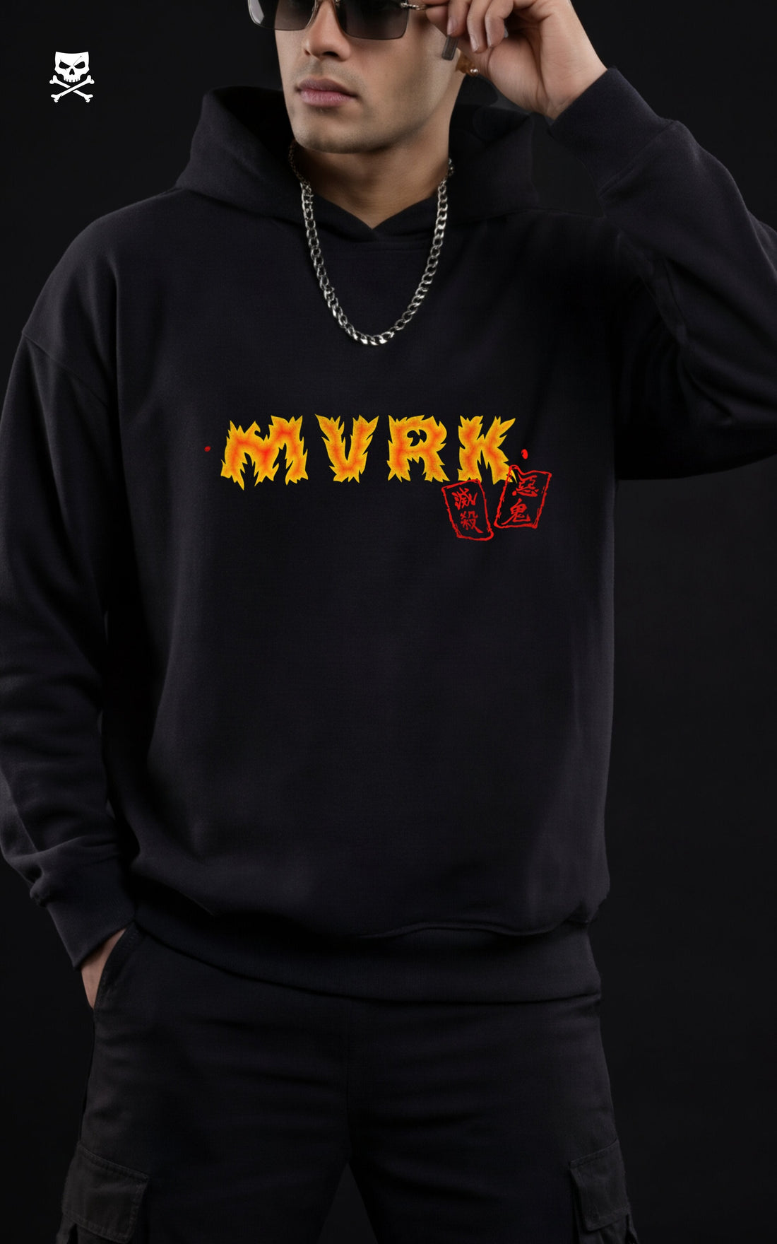 Back view of a model in a black Mavrick official product hoodie featuring a large Kyojuro Rengoku graphic with a golden flame dragon and Japanese kanji, styled with black cargo pants.