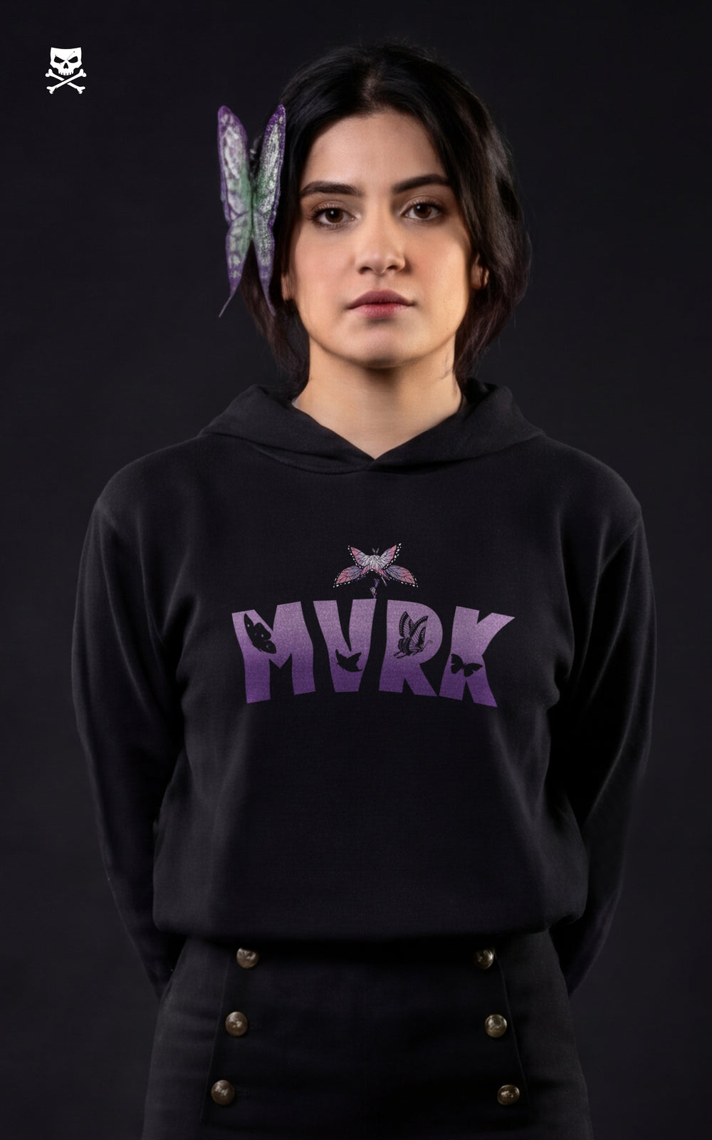 Front view of a woman wearing a Mavrick Shinobu Kocho black anime hoodie with purple "MVRK" gradient lettering and butterfly graphics, featuring a matching butterfly hair accessory.