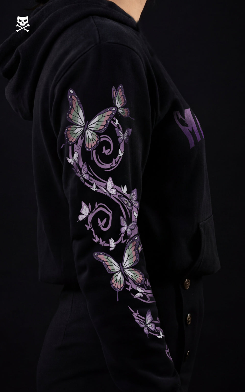 Profile view of a black Demon Slayer streetwear hoodie showing a detailed sleeve print of purple and green butterflies on a vine, inspired by Insect Hashira Shinobu Kocho.