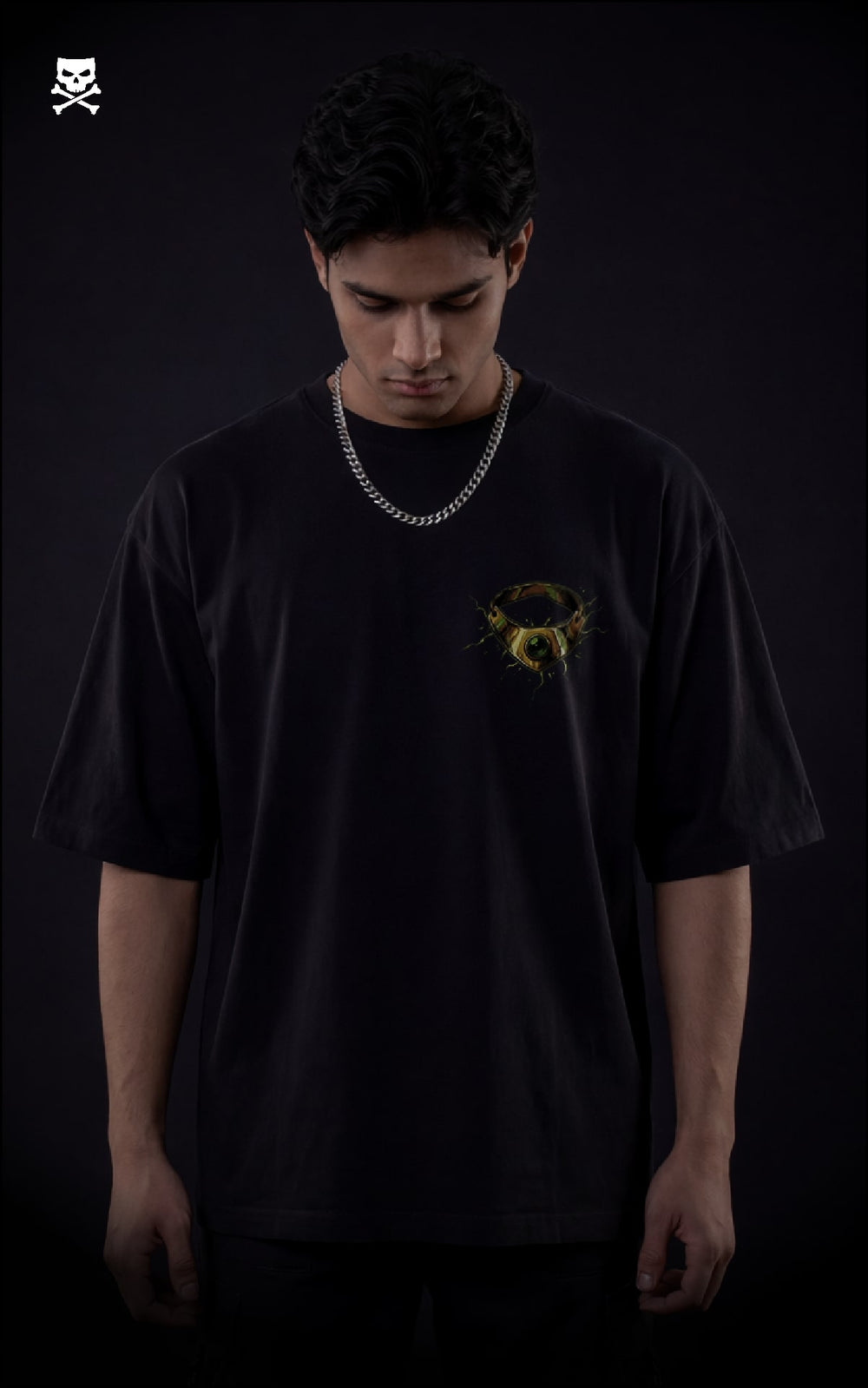 Person wearing a black t-shirt with a yellow broly ring  on a black oversized t-shirt