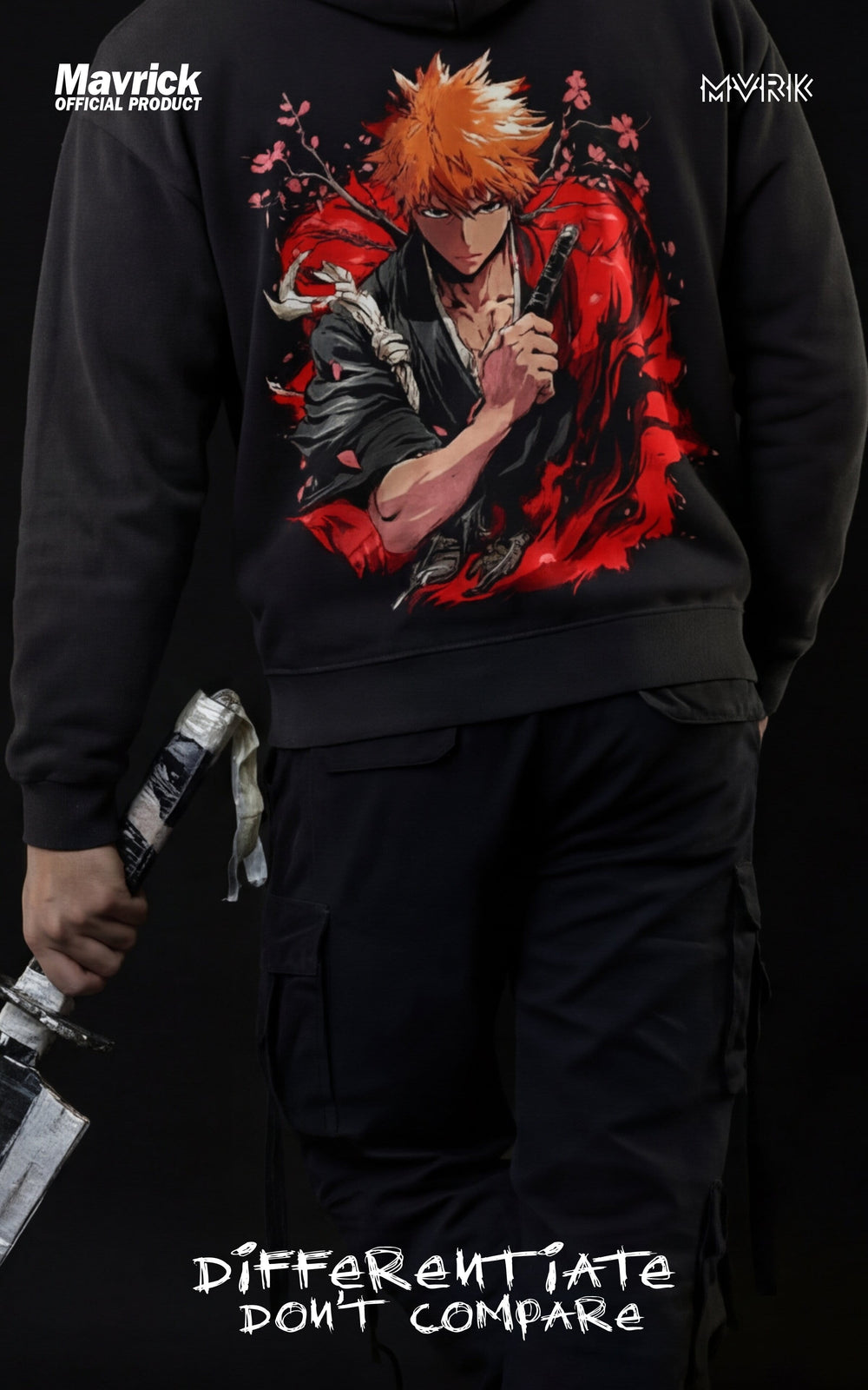 Back view of a model wearing a Mavrick Bleach hoodie featuring a vibrant Ichigo Kurosaki graphic and cherry blossom details, holding a replica Zangetsu sword.