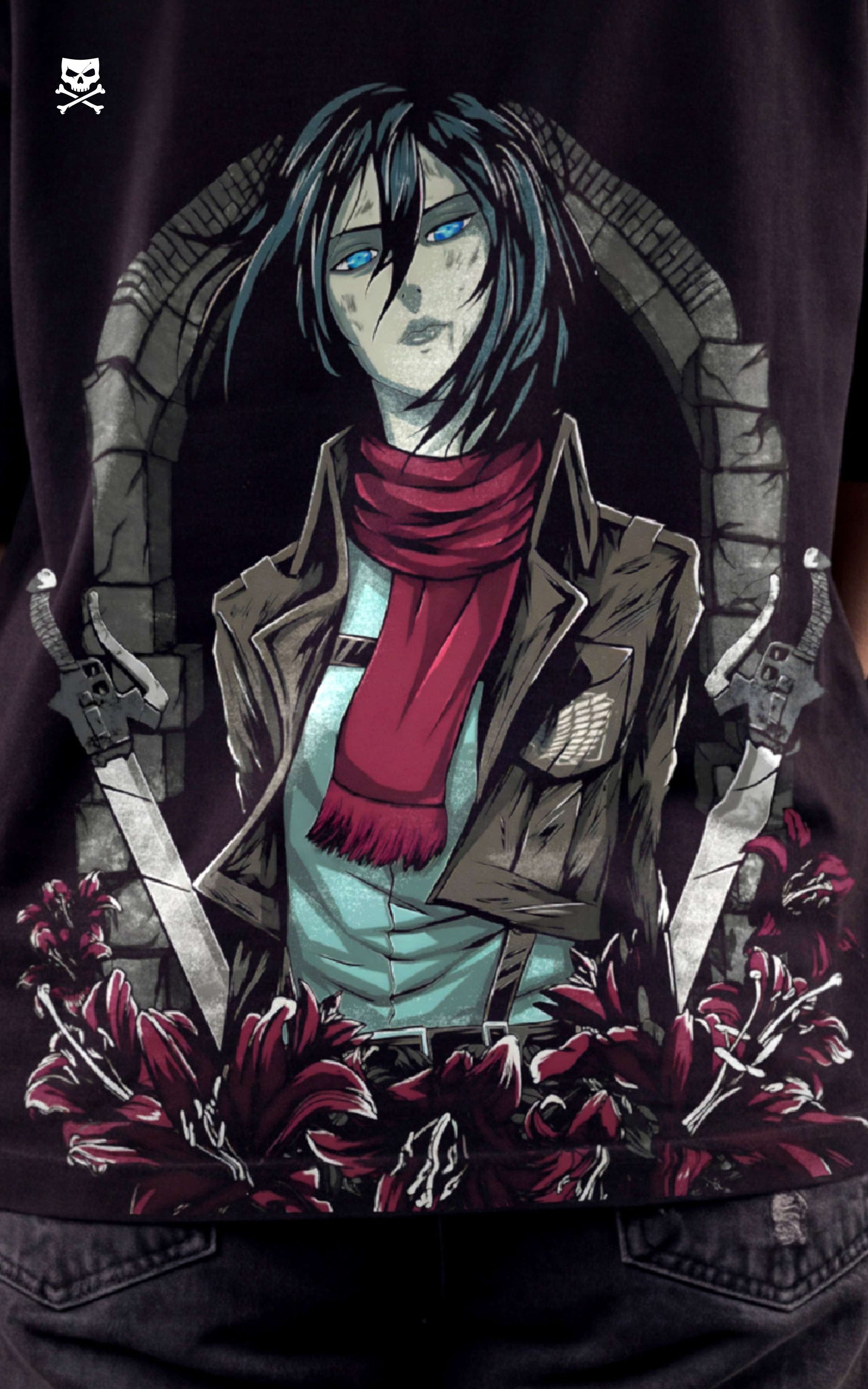Closeup view of a female model wearing a boxy black tee with Mikasa Ackerman, her red scarf, and the Scout Regiment Wings of Freedom.