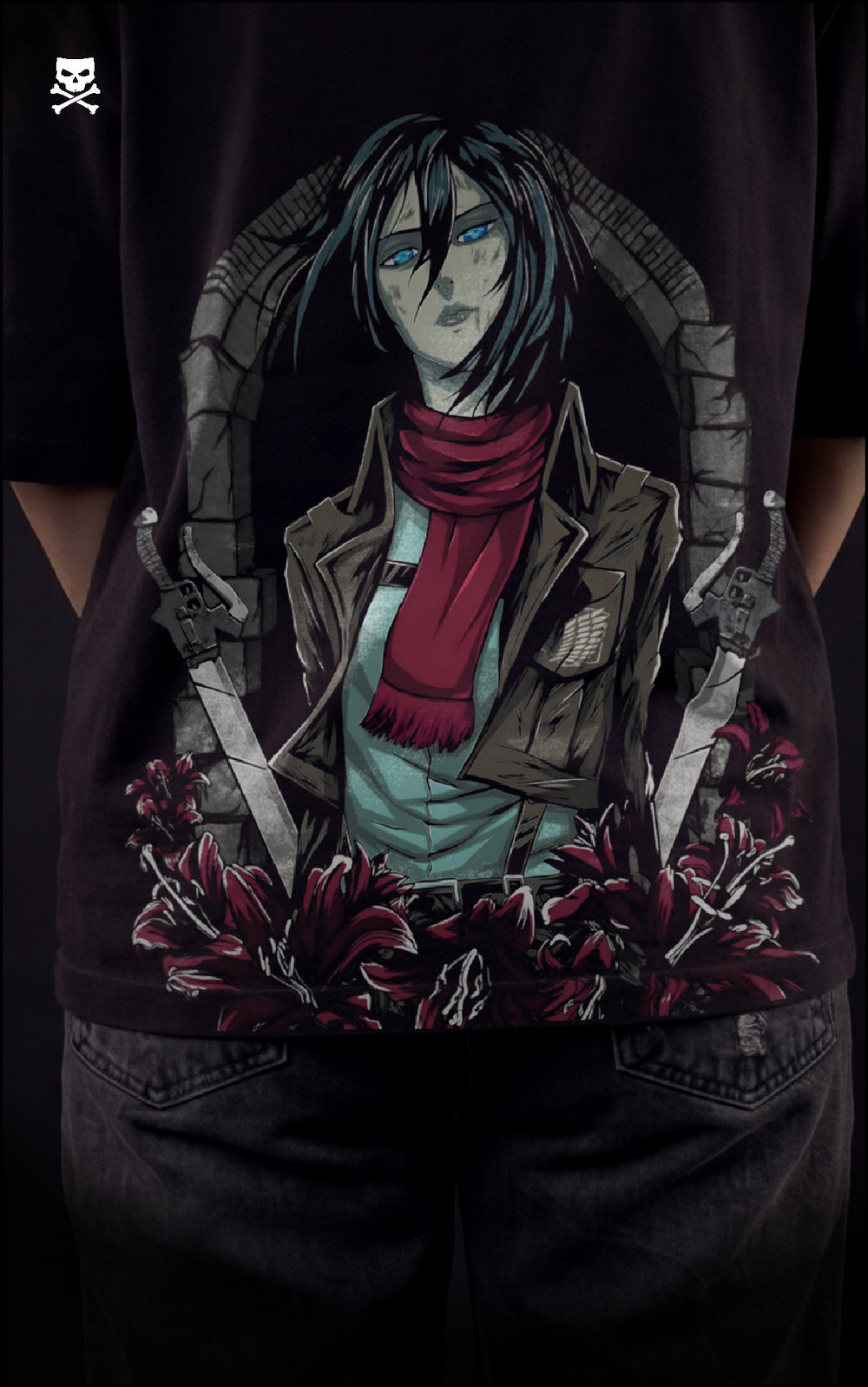 Closeup view of a female model wearing a boxy black tee with Mikasa Ackerman, her red scarf, and the Scout Regiment Wings of Freedom.
