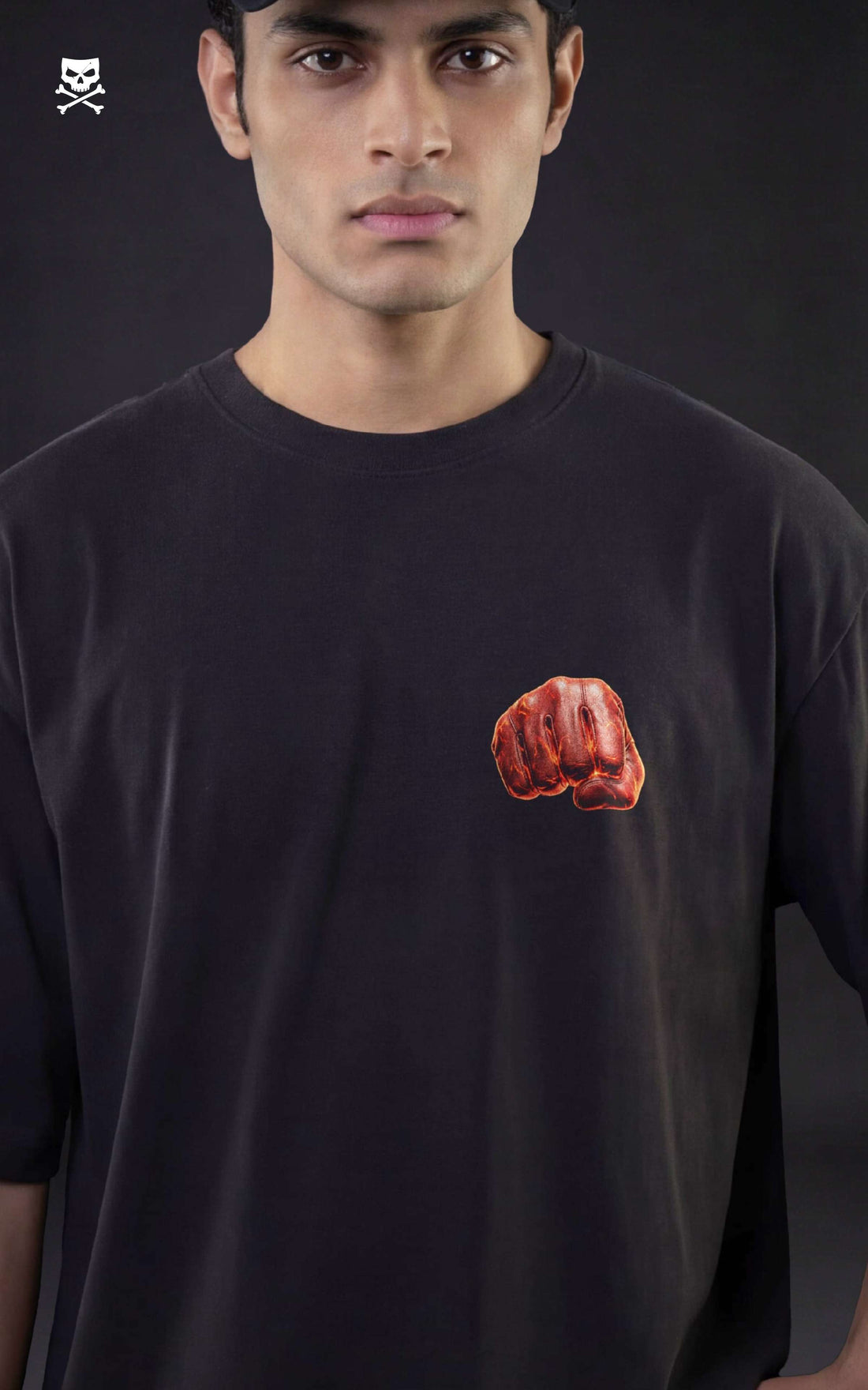 Back view of a male model in a black oversized shirt featuring a "Serious Series" Saitama graphic with an orange explosive background.