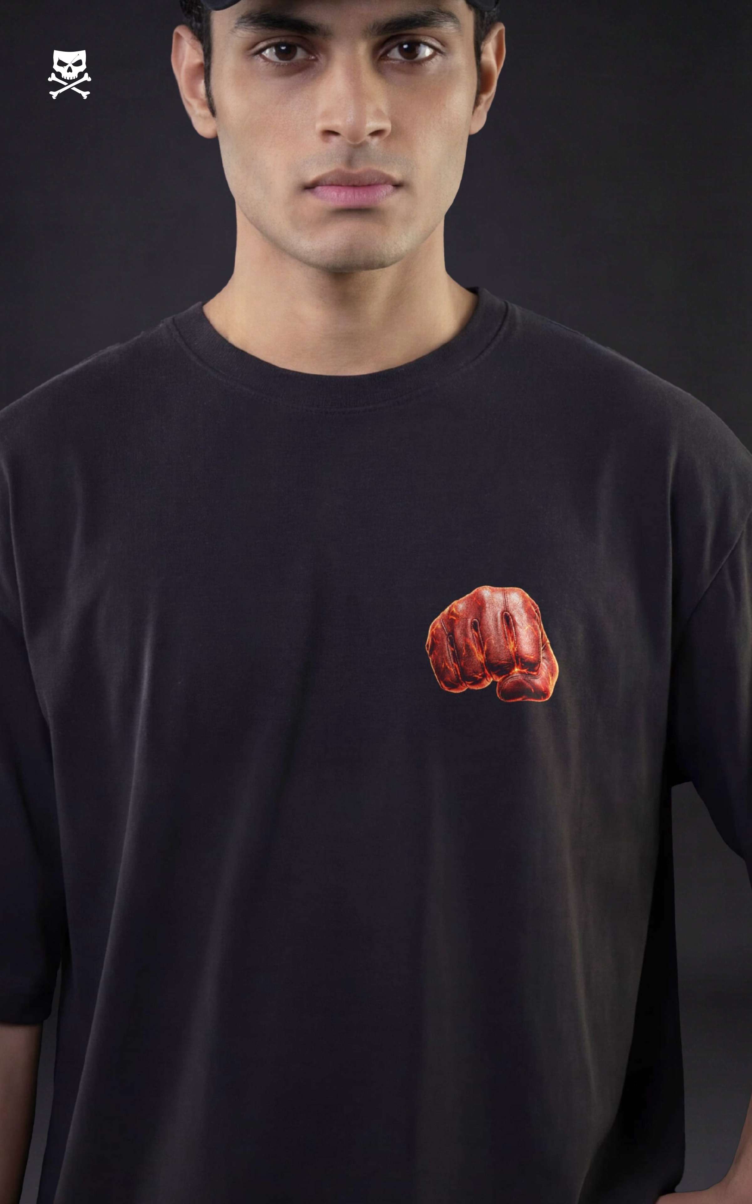 Person wearing a black t-shirt with a red punch from saitama on a dark background