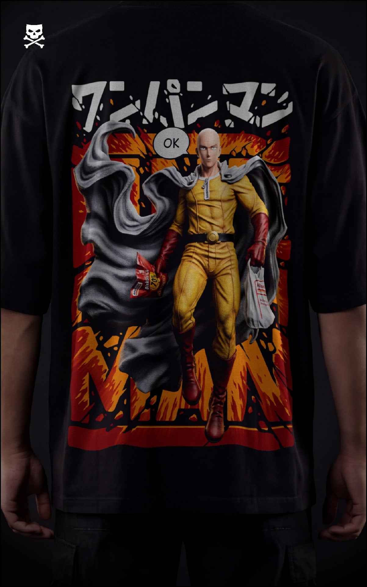 Closeup view of a male model in a black oversized shirt featuring a "Serious Series" Saitama graphic with an orange explosive background.