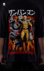 Closeup view of a male model in a black oversized shirt featuring a "Serious Series" Saitama graphic with an orange explosive background.