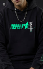 A man wearing a Mavrick Ulquiorra Cifer black anime hoodie with a teal "MVRK" chest logo, featuring a silver chain and sunglasses in a streetwear style.